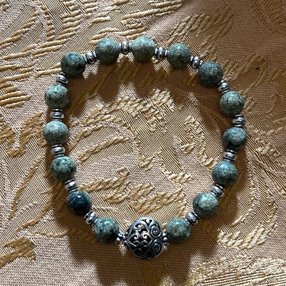 Handcrafted beaded bracelet with metal bead detail